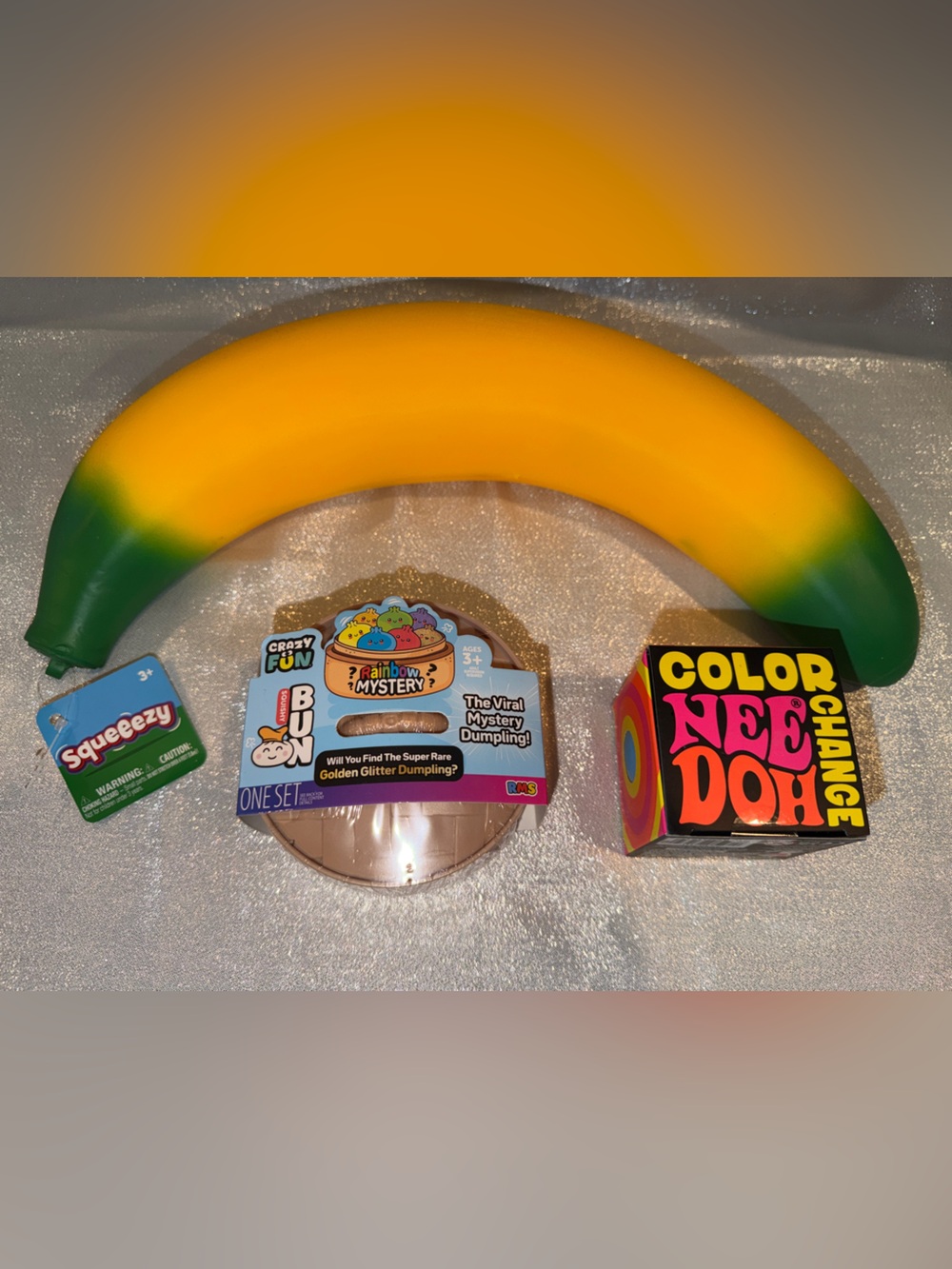 1 NeeDoh Color Change Ball, 1 Glitter Dumpling & 1 Banana Squishy Fidget Toy